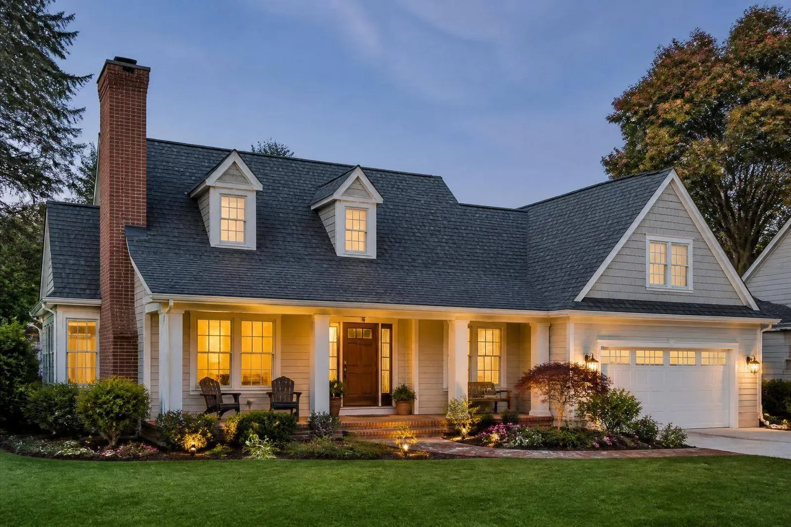 Luxury Delaware home with a brand new architectural asphalt shingle roof at golden hour